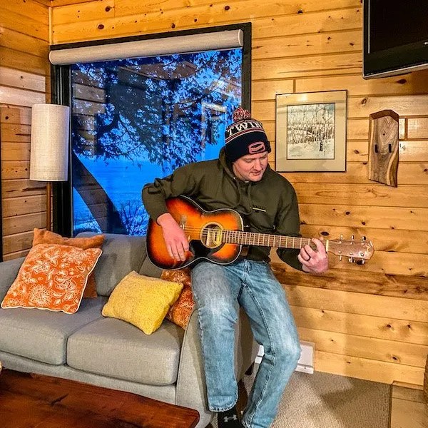 Playing the guitar in Lutsen Sea Villa E3.